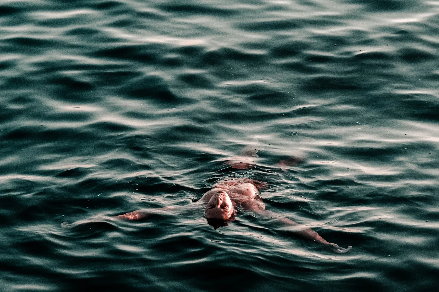 A person swimming in the water.