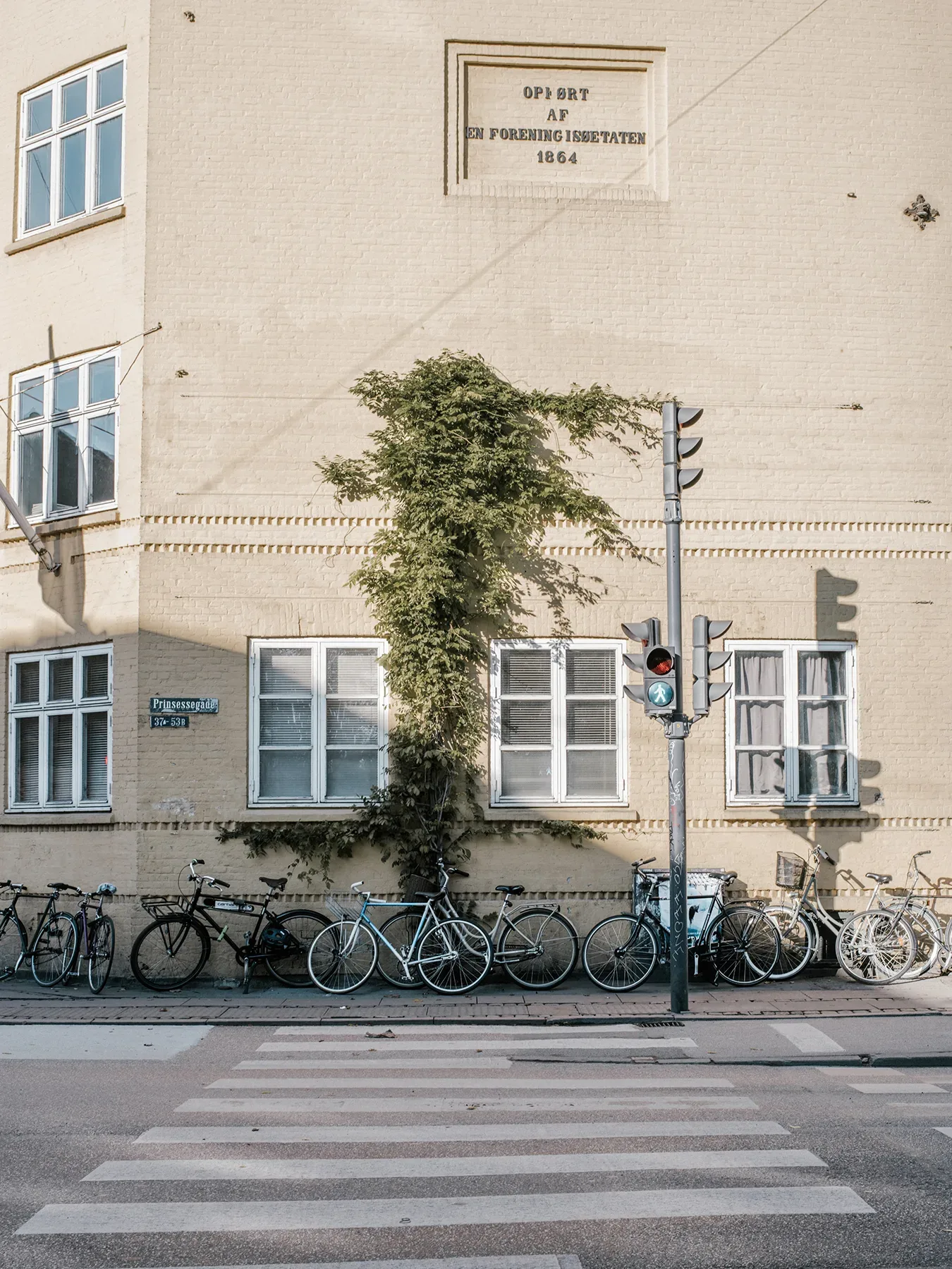 A building with bicycles parked in front of it.