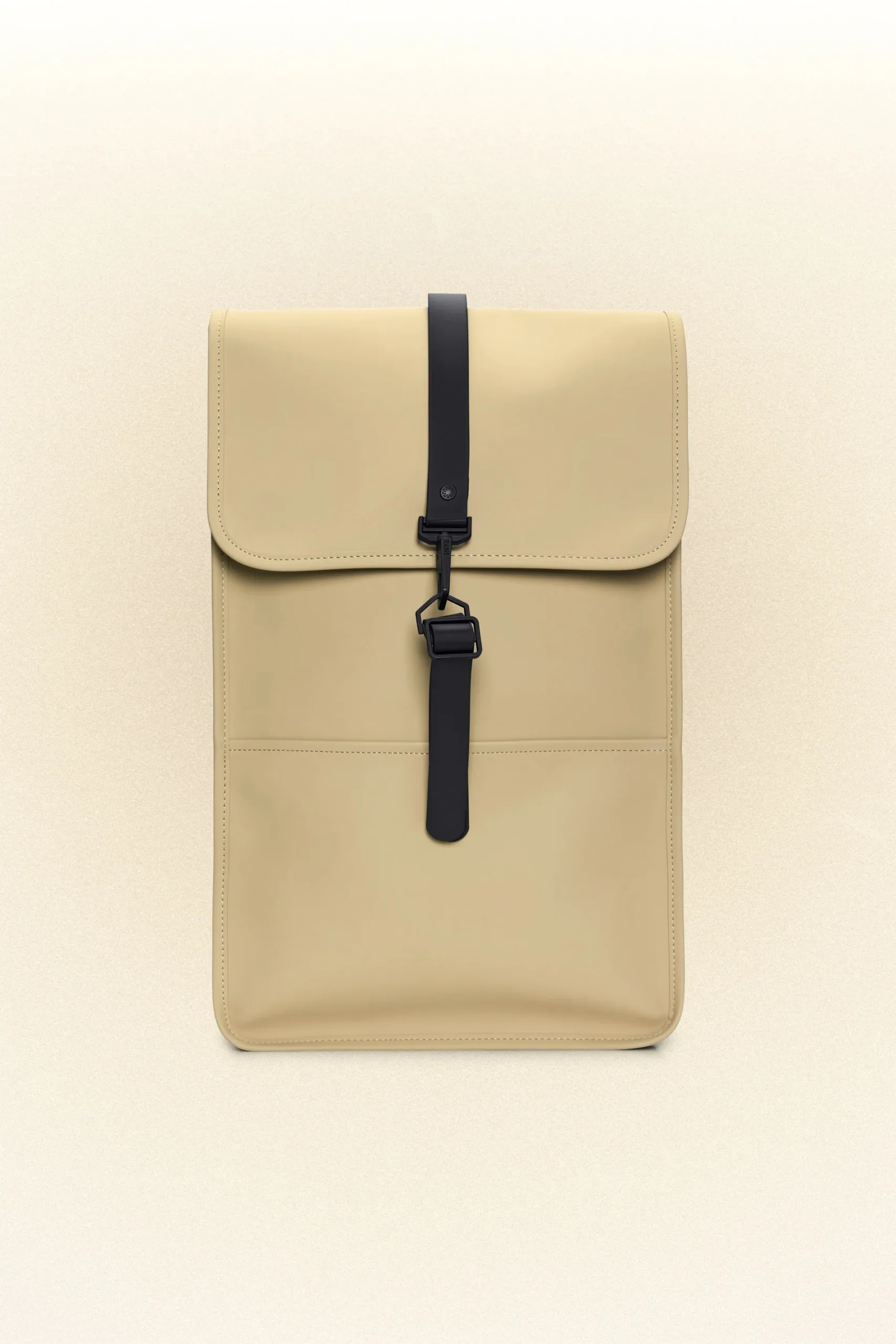 A beige backpack with black straps, perfect for scandinavian minimalists.
