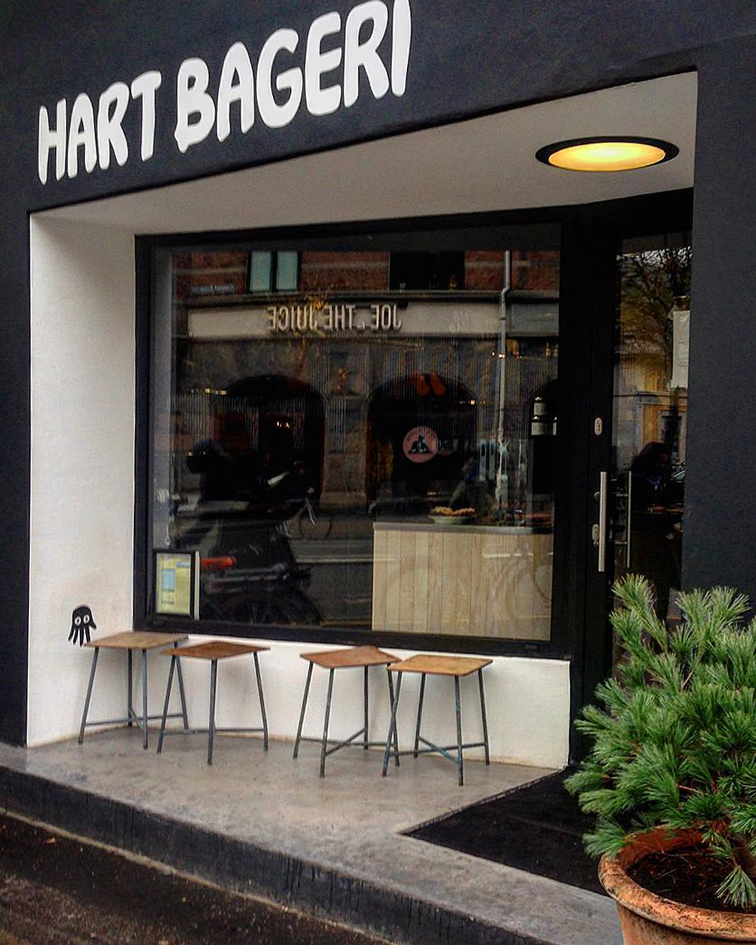 A black and white building with a sign that says hart bageri, located in Copenhagen.