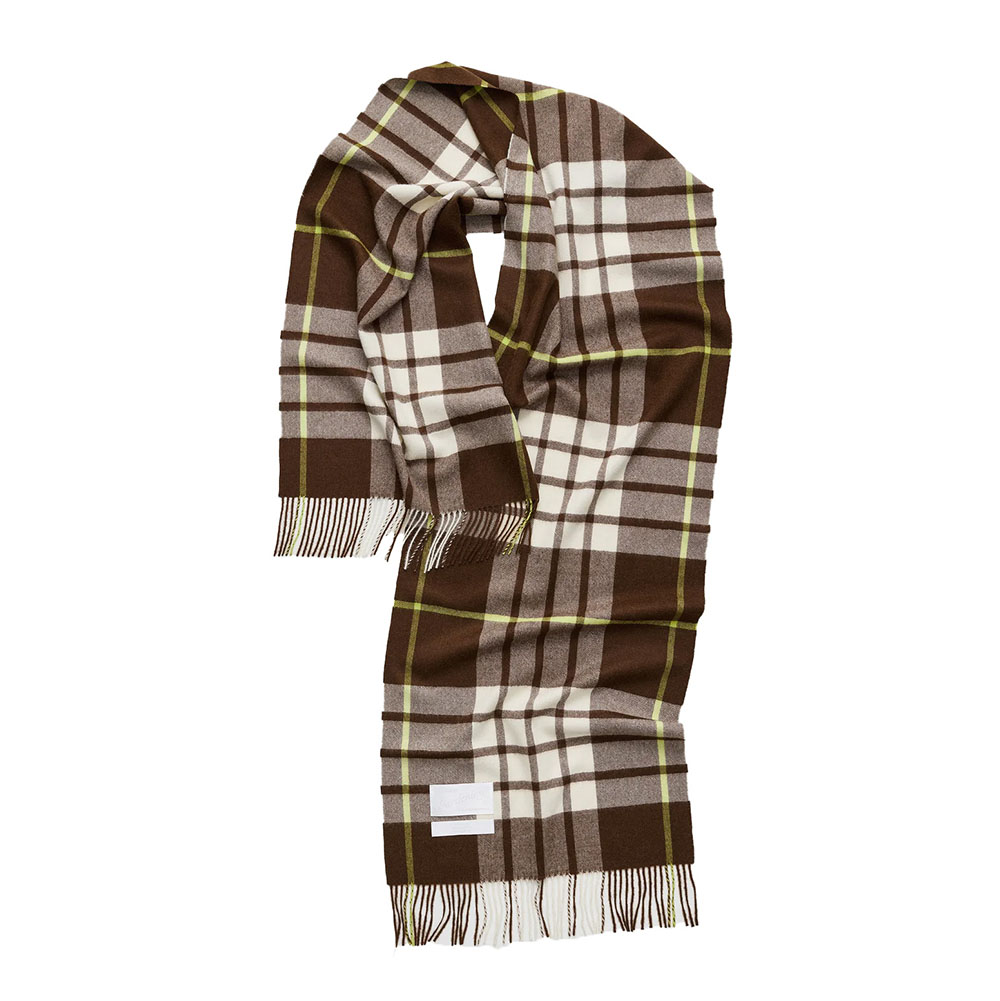 Brown, white, and green plaid scarf with fringe ends laid flat.