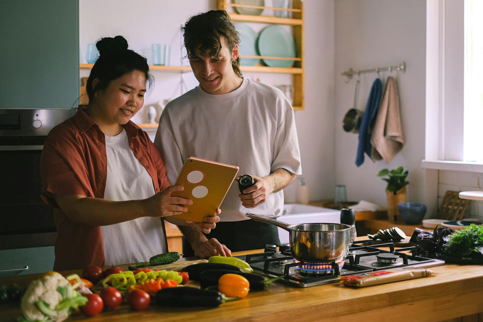 couple cooking together apartment