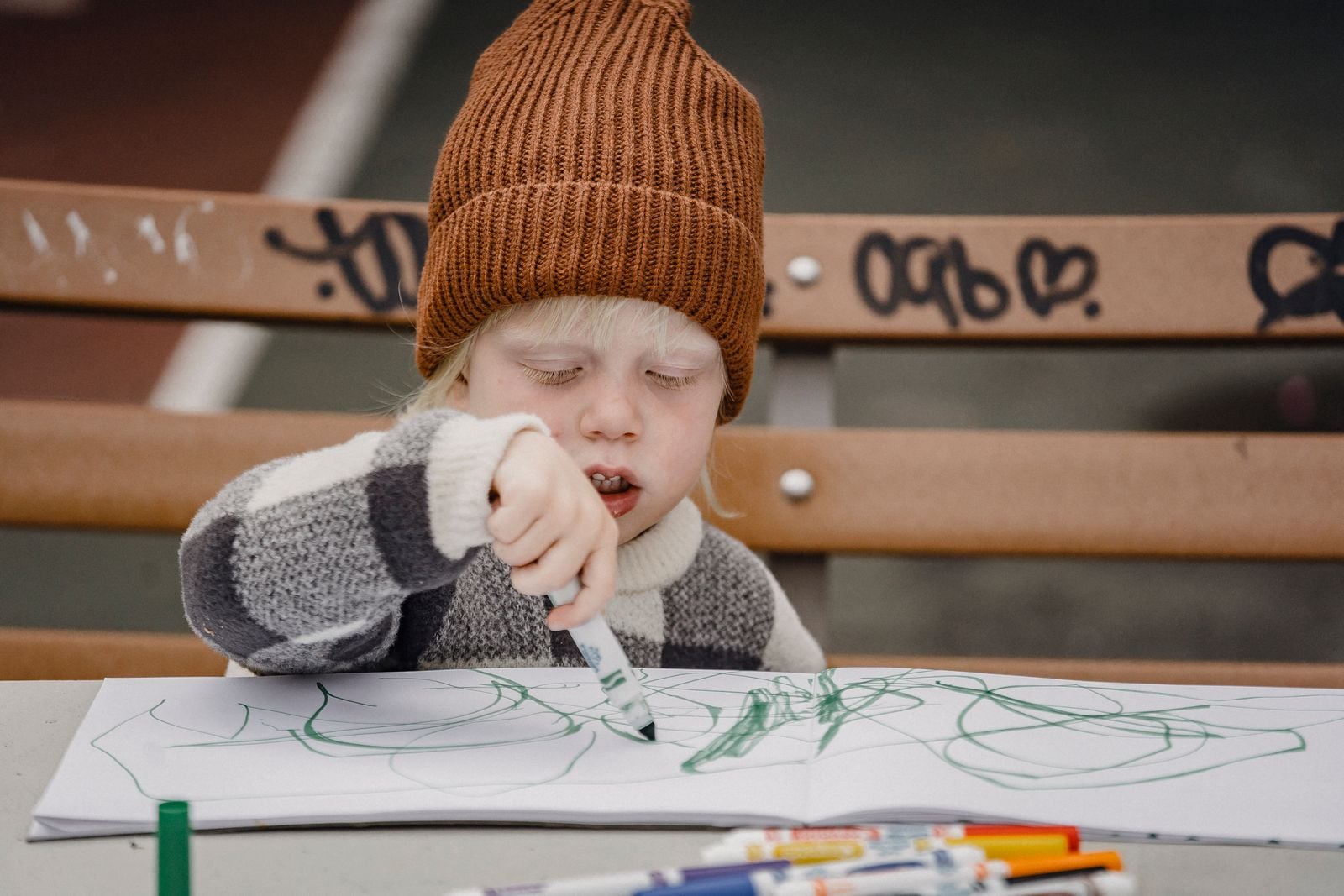 child drawing quietly