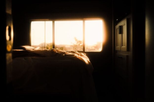 A bedroom bathed in warm morning light