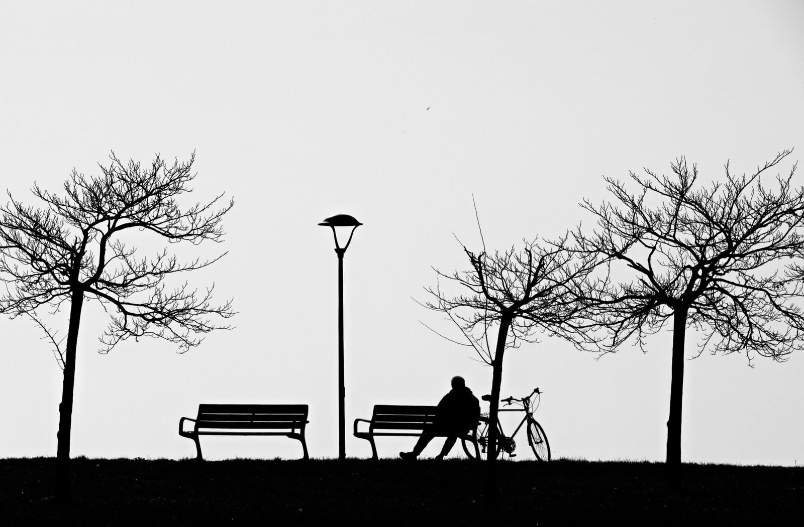 person waiting bench outside
