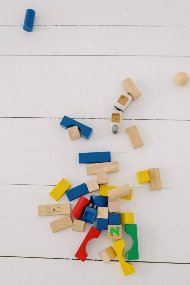 A representative image of scattered wooden building blocks, not a photograph of any person or product discussed in the article.